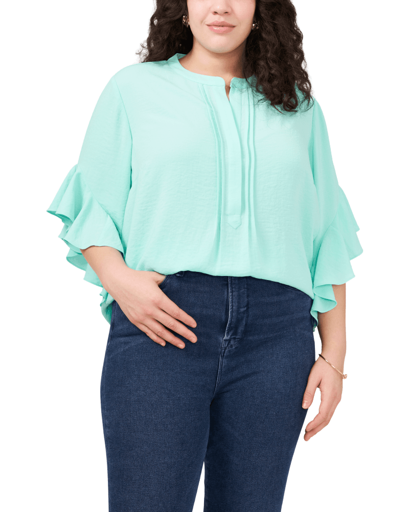 Front of a model wearing a size 1X Willow Flutter Sleeve Henley in COOL WATERS by Vince Camuto. | dia_product_style_image_id:261278